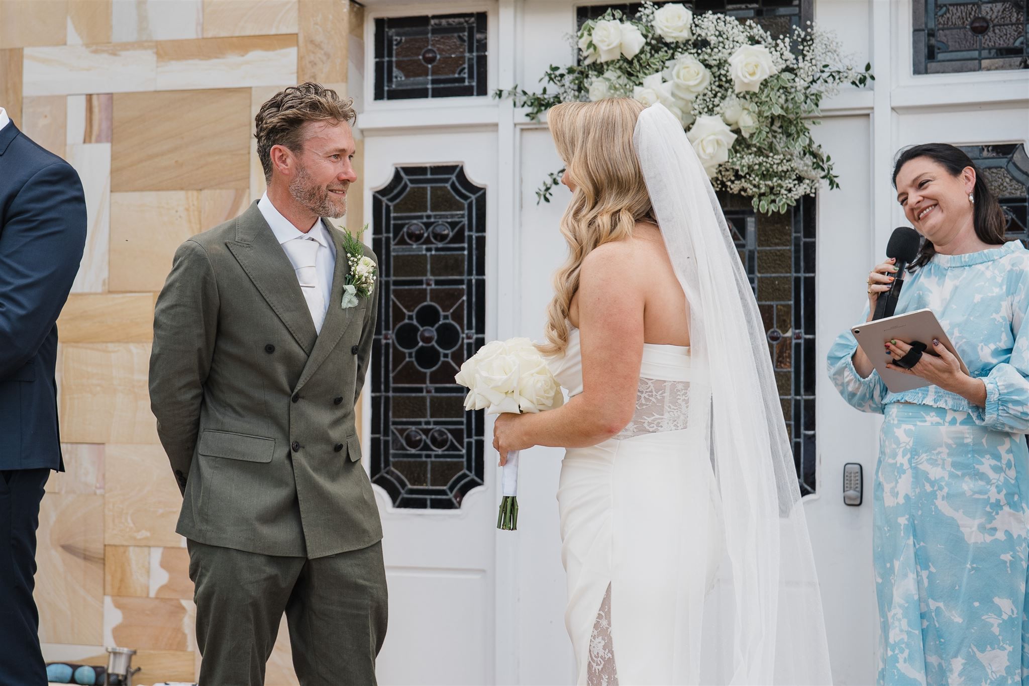 Alice laughing with the couple during the ceremony