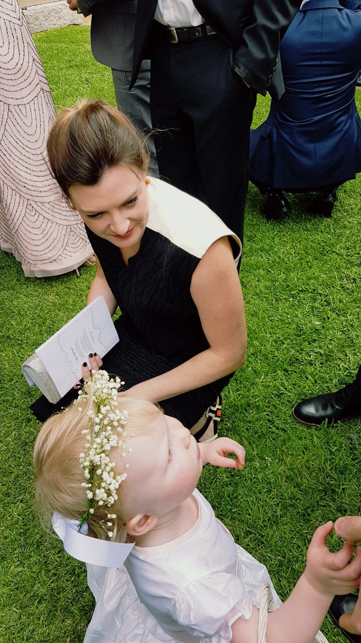 Alice with a flower girl after the ceremony
